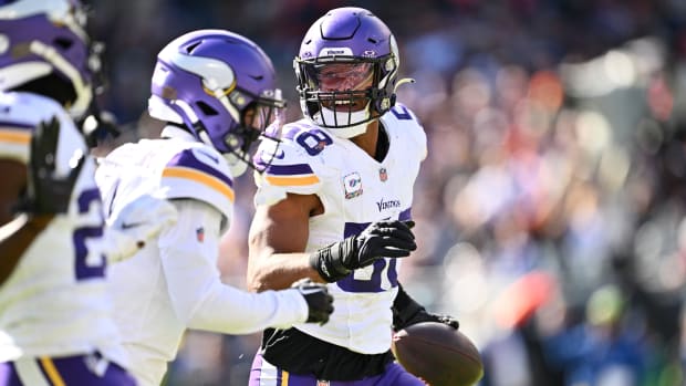 Oct 15, 2023; Chicago, Illinois, USA; Minnesota Vikings linebacker Jordan Hicks (58) celebrates after making an interception in the first half against the Chicago Bears at Soldier Field. Mandatory Credit: Jamie Sabau-USA TODAY Sports